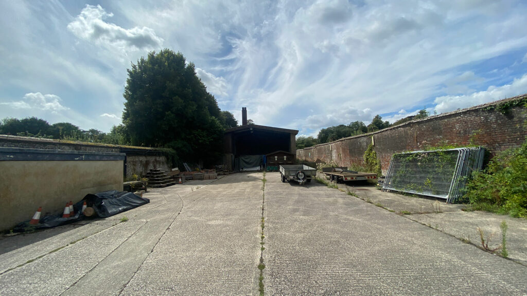 The old biomass yard at West Dean and crinkle-crankle wall
